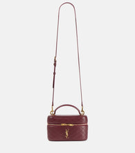 Saint Laurent Gaby patent leather vanity bag. Shop Saint Laurent Top-Handle Bags for women now.