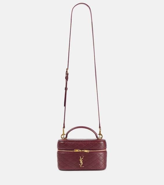 Saint Laurent Gaby patent leather vanity bag. Shop Saint Laurent Top-Handle Bags for women now.