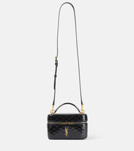 Saint Laurent Gaby quilted patent leather vanity bag. Shop Saint Laurent Top-Handle Bags for women now.