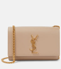 Saint Laurent Kate Small leather shoulder bag. Shop Saint Laurent Shoulder Bags for women now.