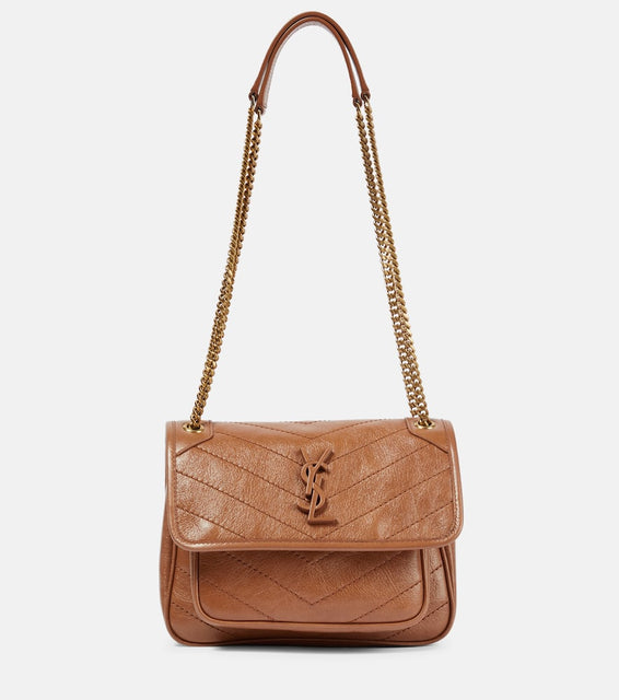 Saint Laurent Niki Baby leather shoulder bag. Shop Saint Laurent Shoulder Bags for women now.