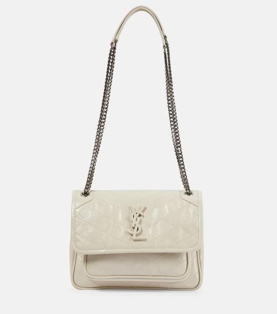 Saint Laurent Niki Baby leather shoulder bag. Shop Saint Laurent Shoulder Bags for women now.