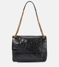 Saint Laurent Niki Medium leather shoulder bag. Shop Saint Laurent Shoulder Bags for women now.