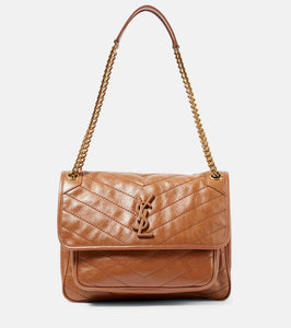 Saint Laurent Niki Medium leather shoulder bag. Shop Saint Laurent Shoulder Bags for women now.