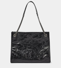 Saint Laurent Niki crinkled leather shopper. Shop Saint Laurent Shoulder Bags for women now.