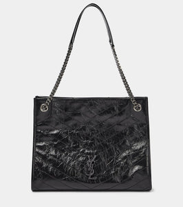 Saint Laurent Niki crinkled leather shopper. Shop Saint Laurent Shoulder Bags for women now.