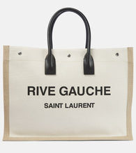 Saint Laurent Rive Gauche canvas tote. Shop Saint Laurent Tote Bags for women now.