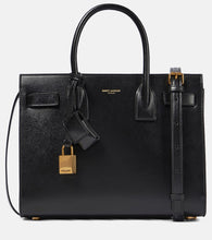 Saint Laurent Sac De Jour Baby leather tote. Shop Saint Laurent Top-Handle Bags for women now.
