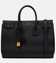 Saint Laurent Sac De Jour Medium leather tote bag. Shop Saint Laurent Tote Bags for women now.