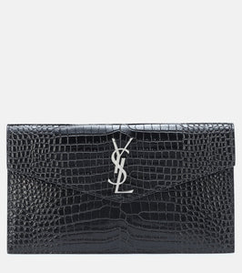 Saint Laurent Uptown embossed leather clutch. Shop Saint Laurent Clutches for women now.