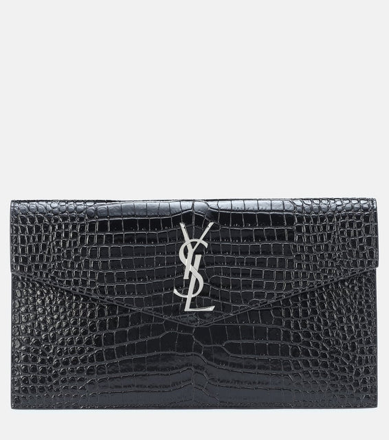Saint Laurent Uptown embossed leather clutch. Shop Saint Laurent Clutches for women now.