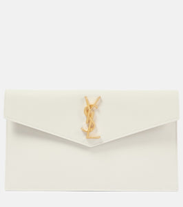 Saint Laurent Uptown leather clutch. Shop Saint Laurent Clutches for women now.