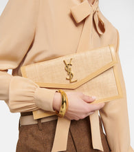 Saint Laurent Uptown leather-trimmed raffia clutch