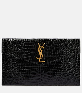 Saint Laurent Uptown patent leather clutch. Shop Saint Laurent Clutches for women now.