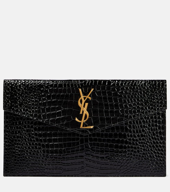 Saint Laurent Uptown patent leather clutch. Shop Saint Laurent Clutches for women now.