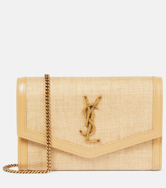 Saint Laurent Uptown raffia wallet on chain. Shop Saint Laurent Clutches for women now.