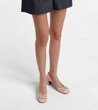 Tod's Slide patent leather pumps