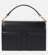 Toteme T-Flap Mini leather crossbody bag. Shop Toteme Top-Handle Bags for women now.