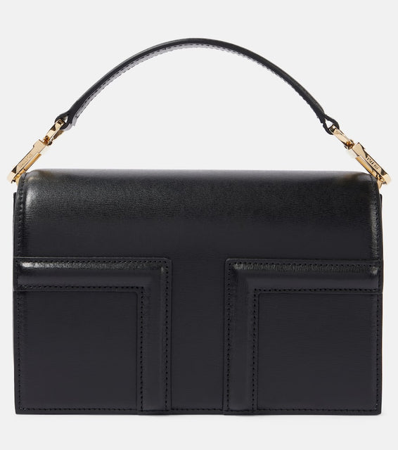 Toteme T-Flap Mini leather crossbody bag. Shop Toteme Top-Handle Bags for women now.