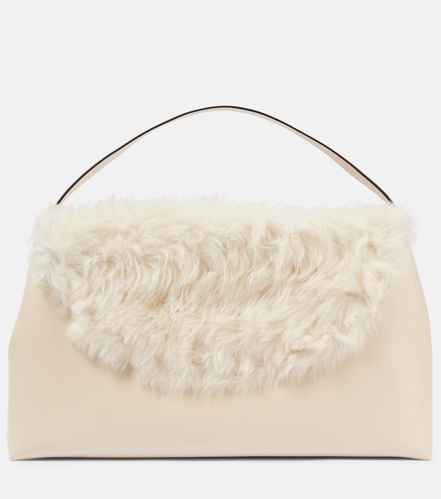 Toteme T-Lock Large shearling-trimmed shoulder bag. Shop Toteme Top-Handle Bags for women now.