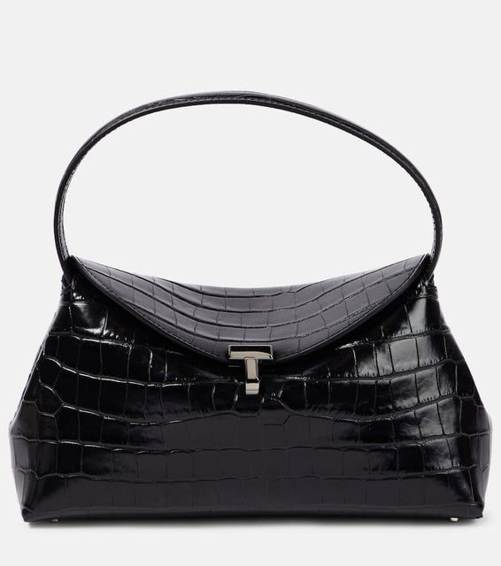 Toteme T-Lock croc-effect leather clutch. Shop Toteme Clutches for women now.
