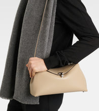 Toteme T-Lock leather clutch