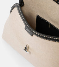 Toteme T-Lock leather-trimmed canvas clutch