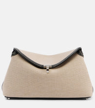 Toteme T-Lock leather-trimmed canvas clutch. Shop Toteme Clutches for women now.