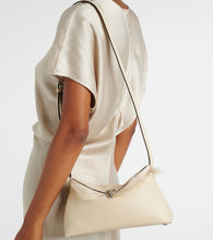 Toteme T-Lock shearling-lined leather clutch