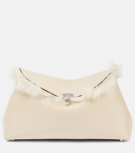 Toteme T-Lock shearling-lined leather clutch. Shop Toteme Clutches for women now.