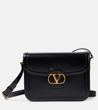 Valentino Garavani 9TO5 VLogo Signature leather shoulder bag. Shop Valentino Garavani Crossbody Bags for women now.