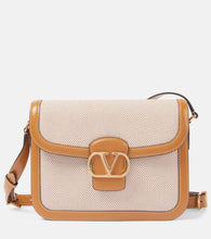 Valentino Garavani 9to5 VLogo Signature canvas shoulder bag. Shop Valentino Garavani Shoulder Bags for women now.