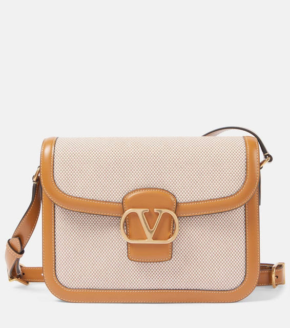 Valentino Garavani 9to5 VLogo Signature canvas shoulder bag. Shop Valentino Garavani Shoulder Bags for women now.