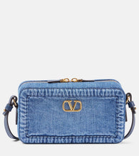 Valentino Garavani Alltime Mini denim shoulder bag. Shop Valentino Garavani Crossbody Bags for women now.