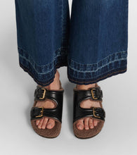 Valentino Garavani Faux fur-trimmed leather sandals