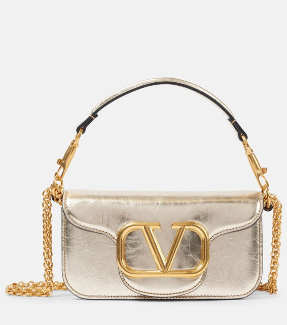 Valentino Garavani Loc√É¬≤ Small metallic leather shoulder bag. Shop Valentino Garavani Top-Handle Bags for women now.