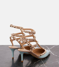 Valentino Garavani Rockstud Caged 65 patent leather pumps