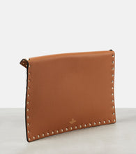 Valentino Garavani Rockstud Large leather-trimmed raffia clutch
