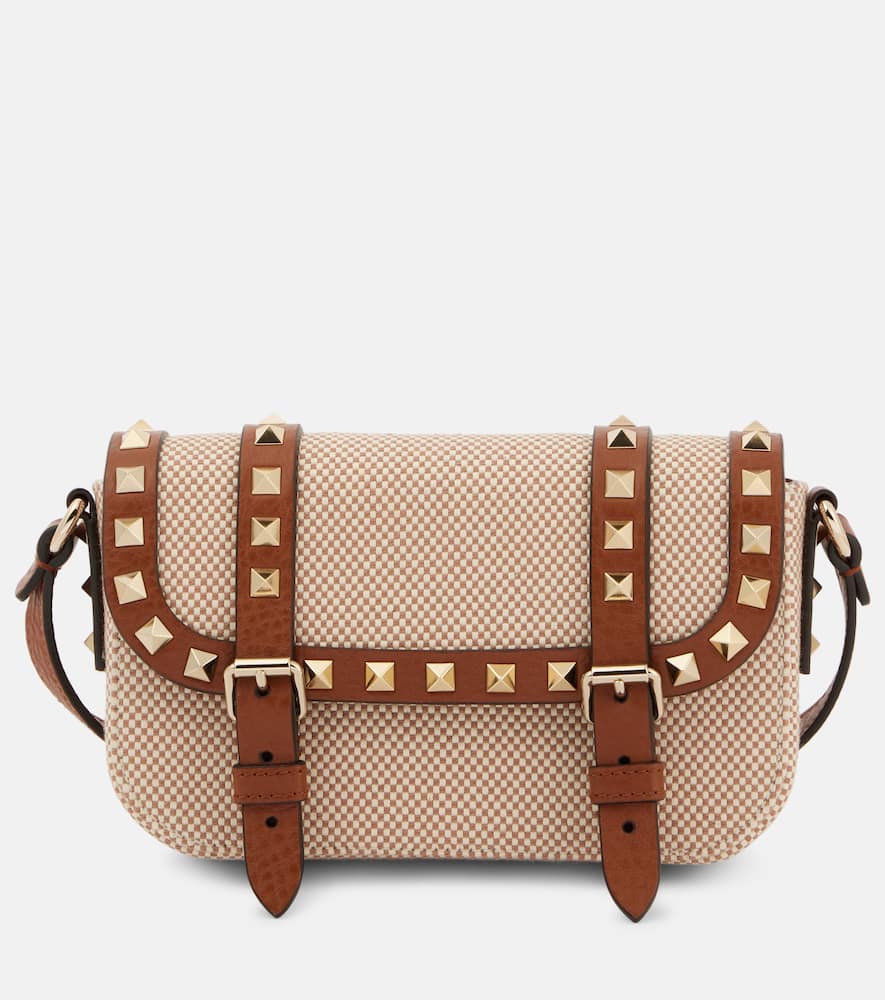 Valentino Garavani Rockstud Micro canvas crossbody bag. Shop Valentino Garavani Crossbody Bags for women now.