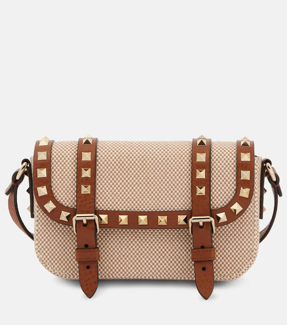 Valentino Garavani Rockstud Micro canvas crossbody bag. Shop Valentino Garavani Crossbody Bags for women now.