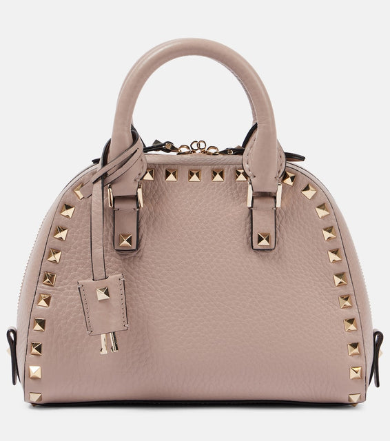 Valentino Garavani Rockstud Small leather tote bag. Shop Valentino Garavani Top-Handle Bags for women now.