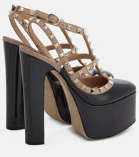 Valentino Garavani Rockstud patent leather platform pumps