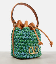 Valentino Garavani VLogo Mini embellished raffia bucket bag