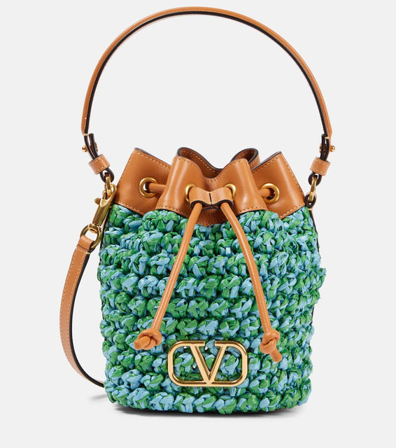 Valentino Garavani VLogo Mini embellished raffia bucket bag. Shop Valentino Garavani Bucket Bags for women now.