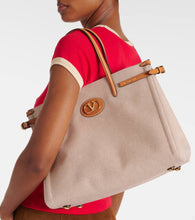 Valentino Garavani VLogo Mini leather-trimmed shoulder bag