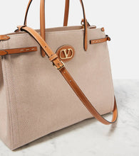 Valentino Garavani VLogo Mini leather-trimmed shoulder bag