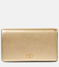 Valentino Garavani VLogo Signature Mini leather shoulder bag. Shop Valentino Garavani Clutches for women now.