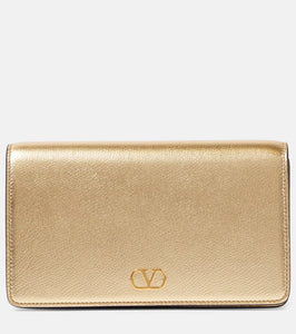 Valentino Garavani VLogo Signature Mini leather shoulder bag. Shop Valentino Garavani Clutches for women now.