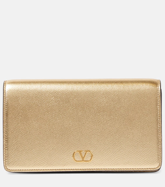 Valentino Garavani VLogo Signature Mini leather shoulder bag. Shop Valentino Garavani Clutches for women now.