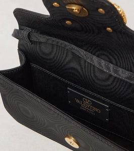 Valentino Garavani VLogo Signature embellished moir√É¬© clutch